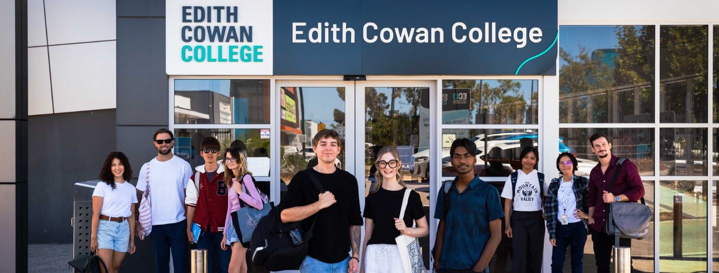 College students standing together in front of the main entrance of Edith Cowan College.