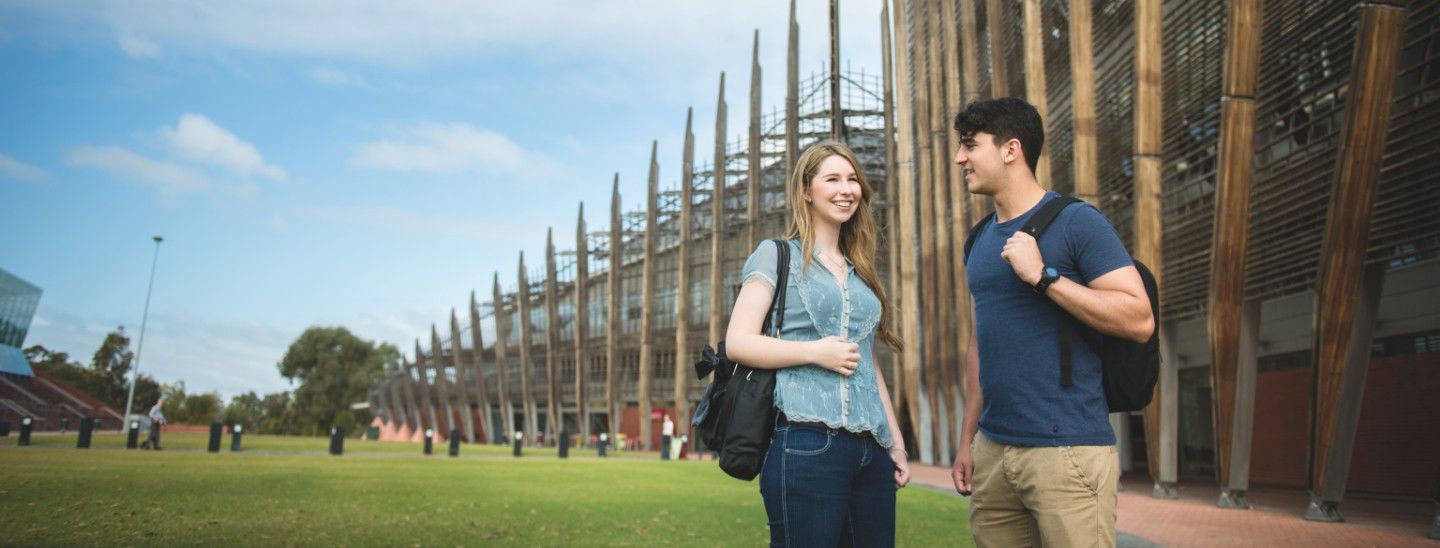 Female and male standing outside