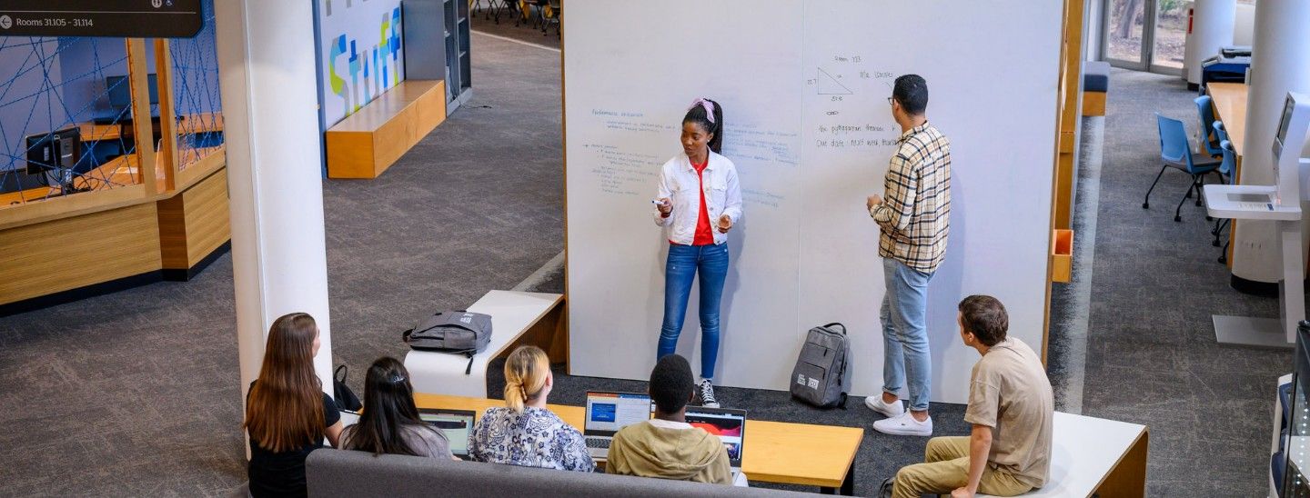 Group brainstorming on whiteboard