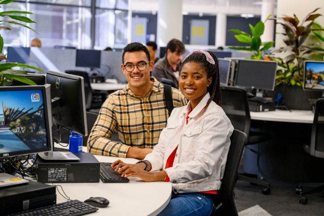 Male and female in computer room