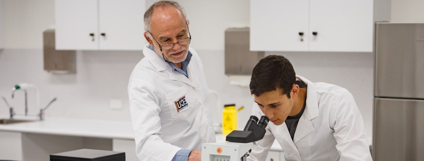 Male student and teacher testing in lab