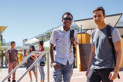 Male students walking down stairs