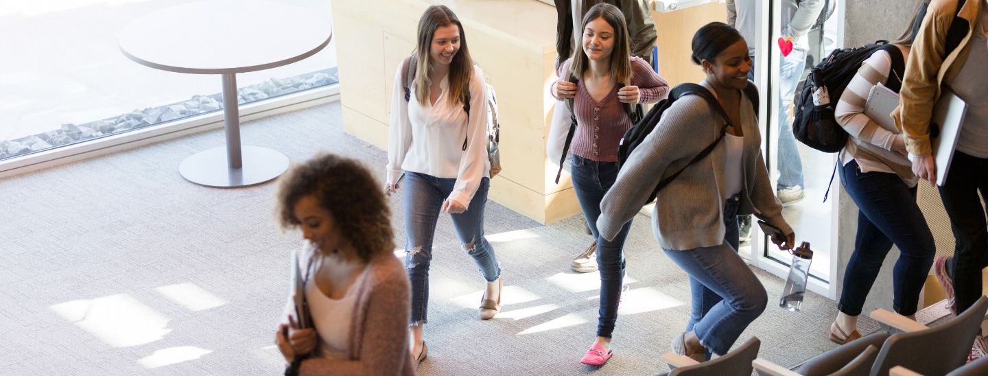 Mixed students entering lecture theatre