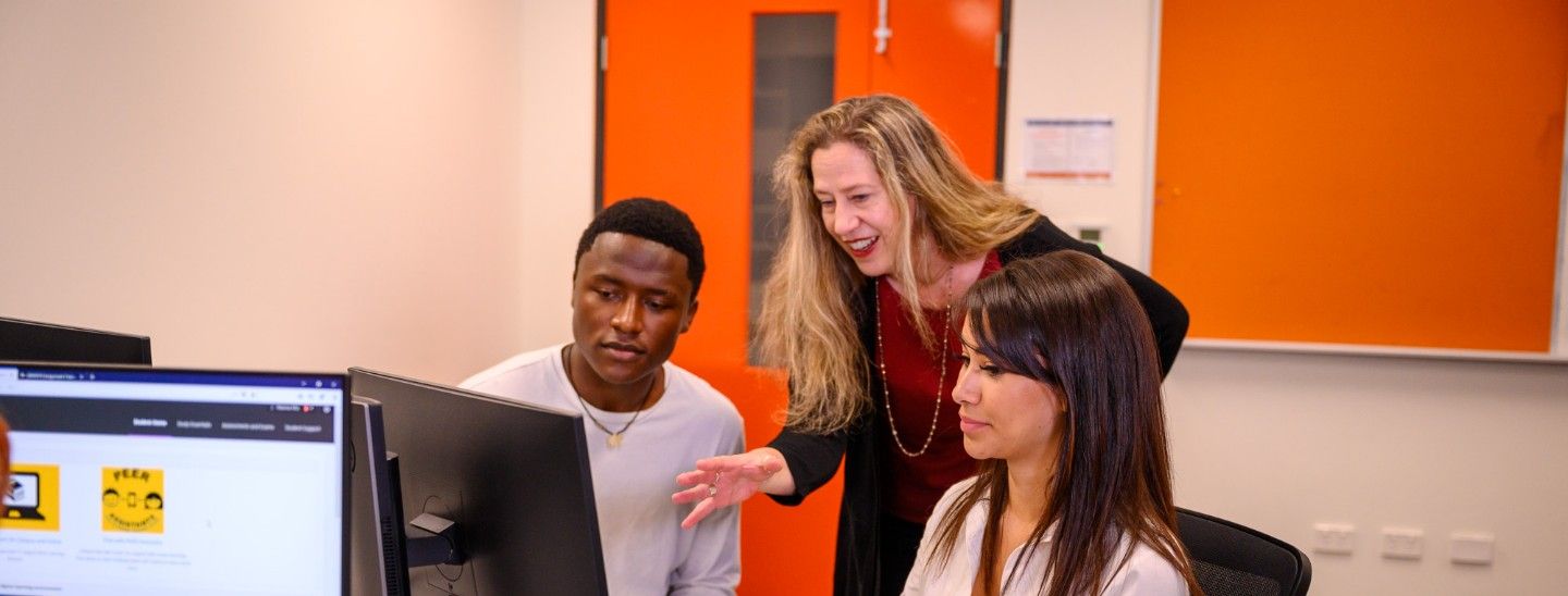 Teacher helping students