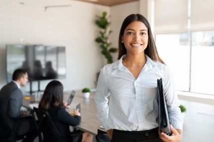Off campus female holding folder