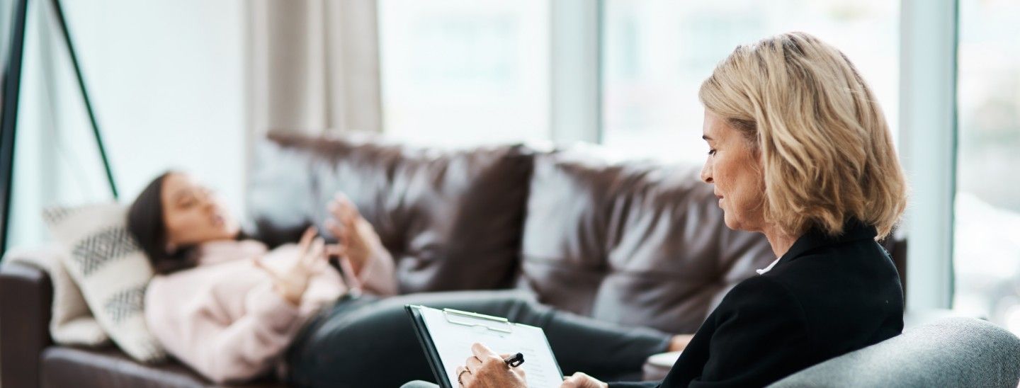 Off campus female therapist notetaking