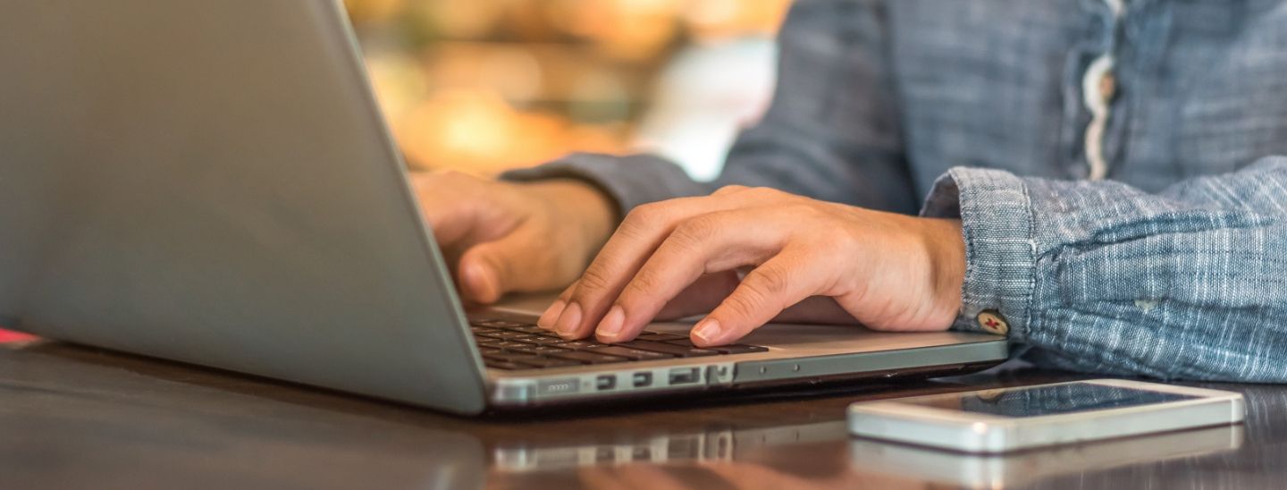 Off campus female typing on laptop
