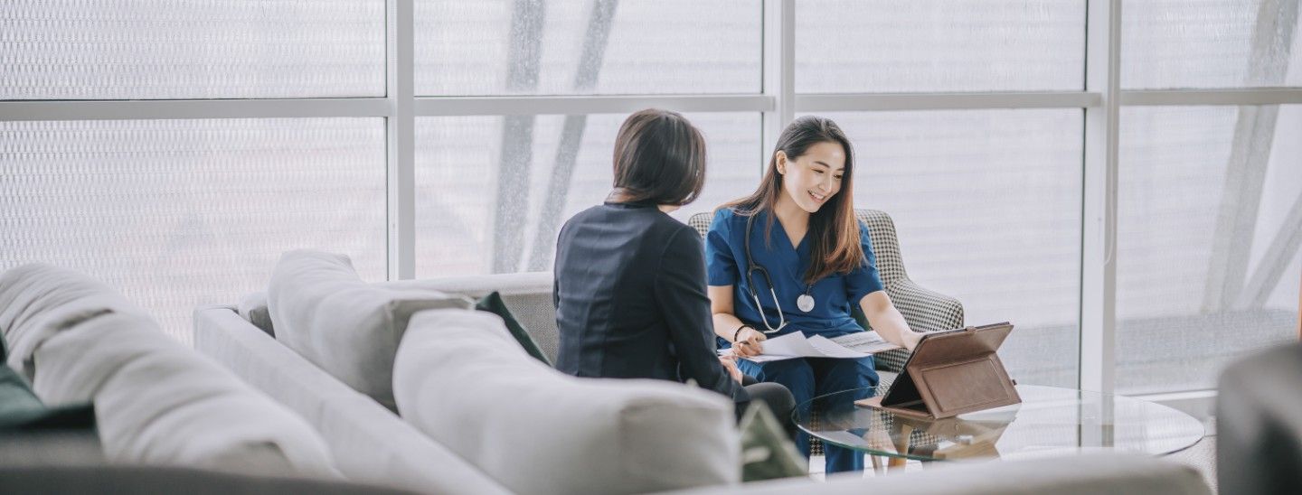 Off campus medical worker discussing with patient