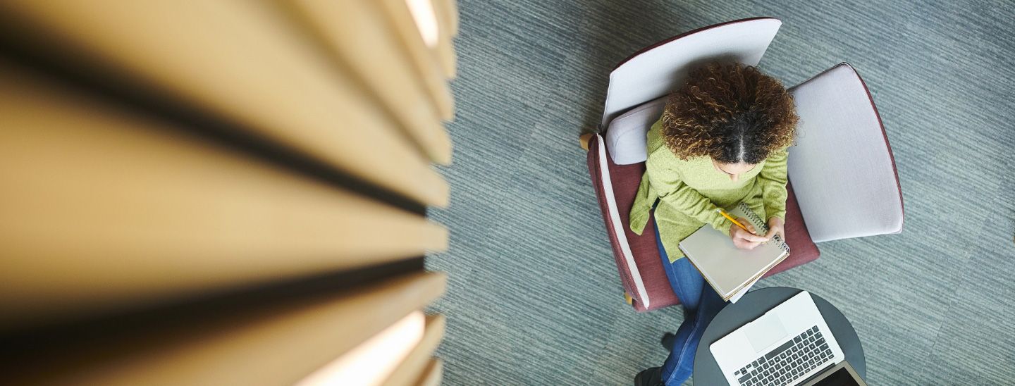 On campus top view woman studying