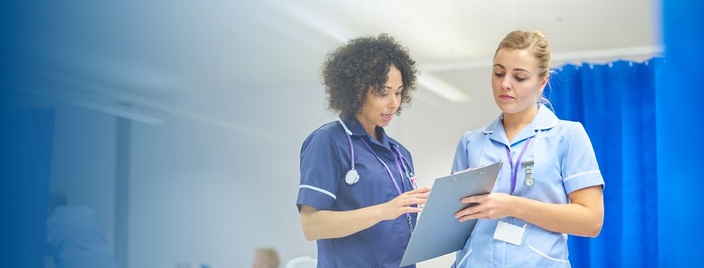 Female medical students discuss in the classroom